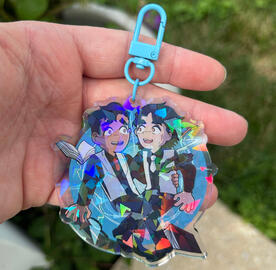 Acrylic charm with shattered holo pattern and light blue clasp
